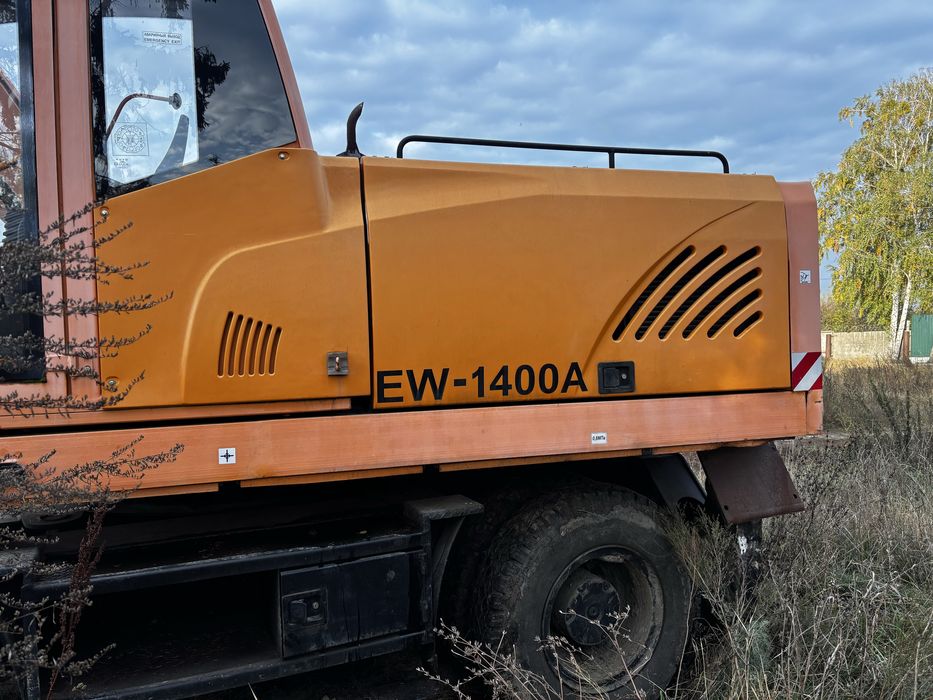 Экскаватор пневмоколісний АМКОДОР EW-1400