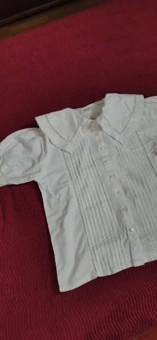 Blusa c/ gola manga curta.