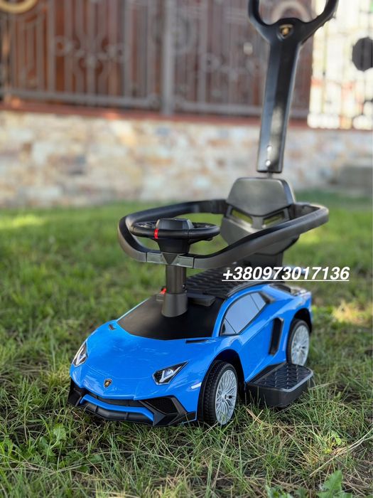 Толокар машинка с ручкой поворотной кожаное сидение музыка Новый