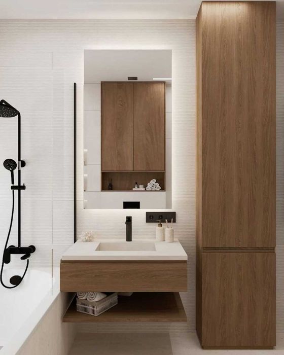 Стільниці з литими умивальниками, тумби і дзеркала з підсвіткою.