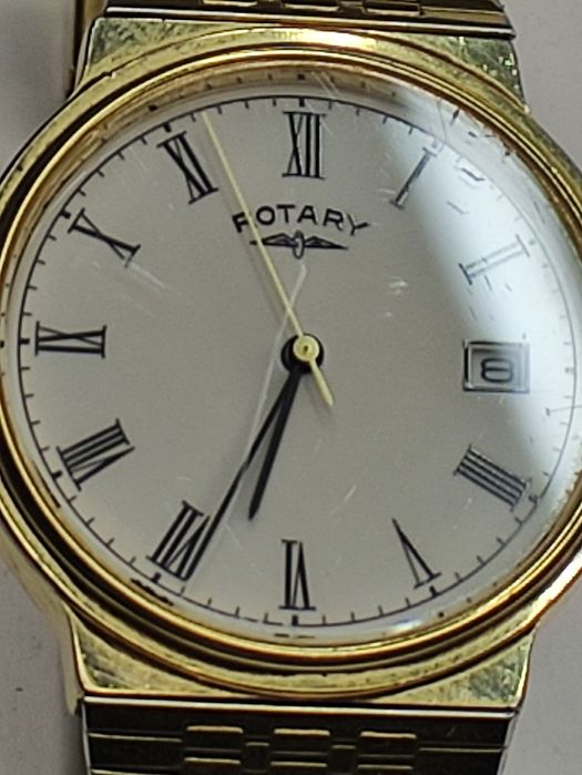 Rotary годинник наручний .позолота.
