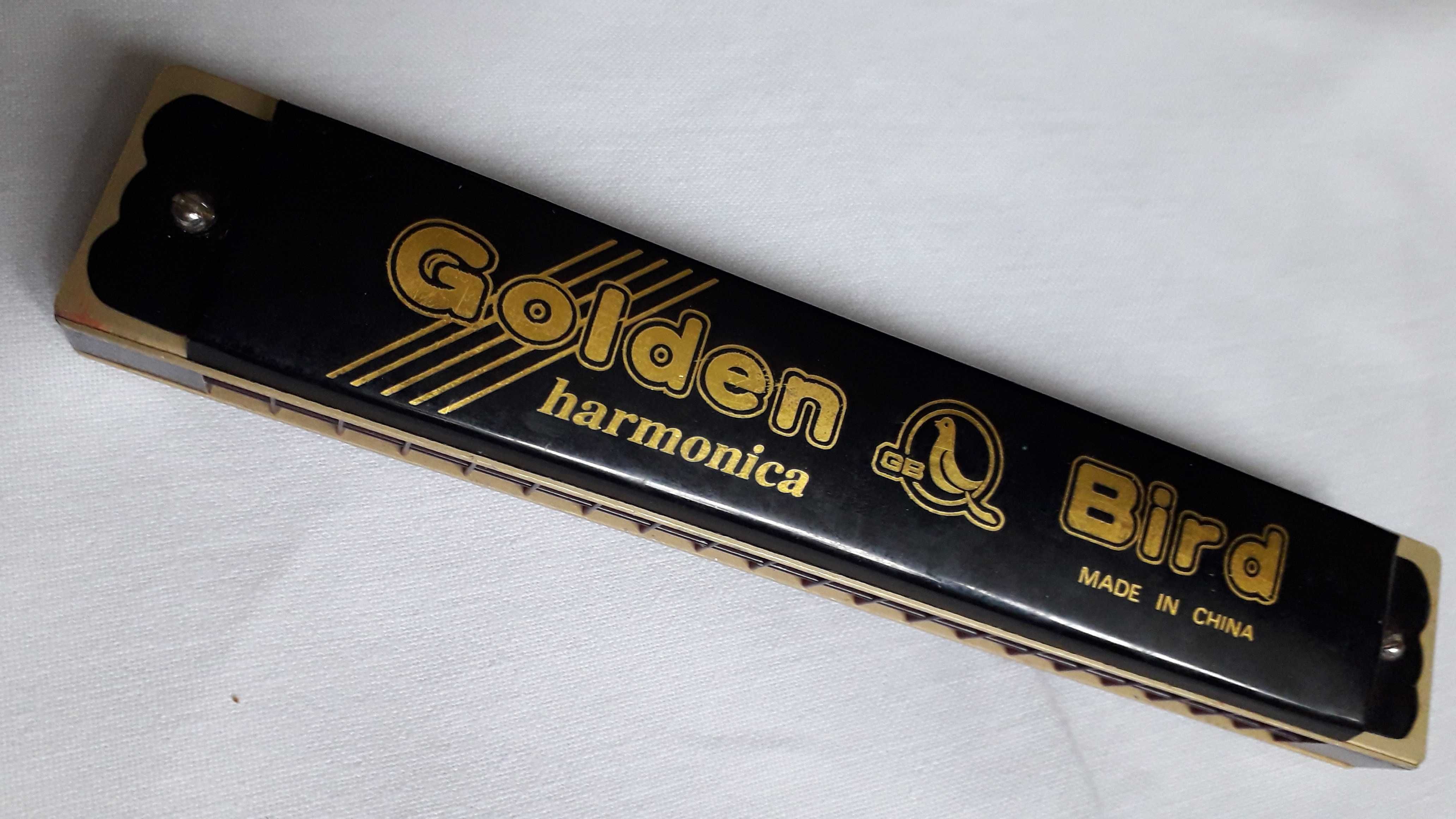 Golden bird harmonica top