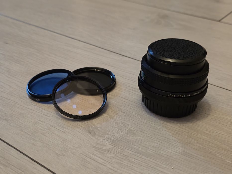 Комплект Nikon D7000 + об'єктиви + спалах і синхронізатор Godox в сумці.