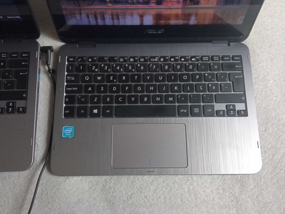Two ASUS TP203N459820659691366401
