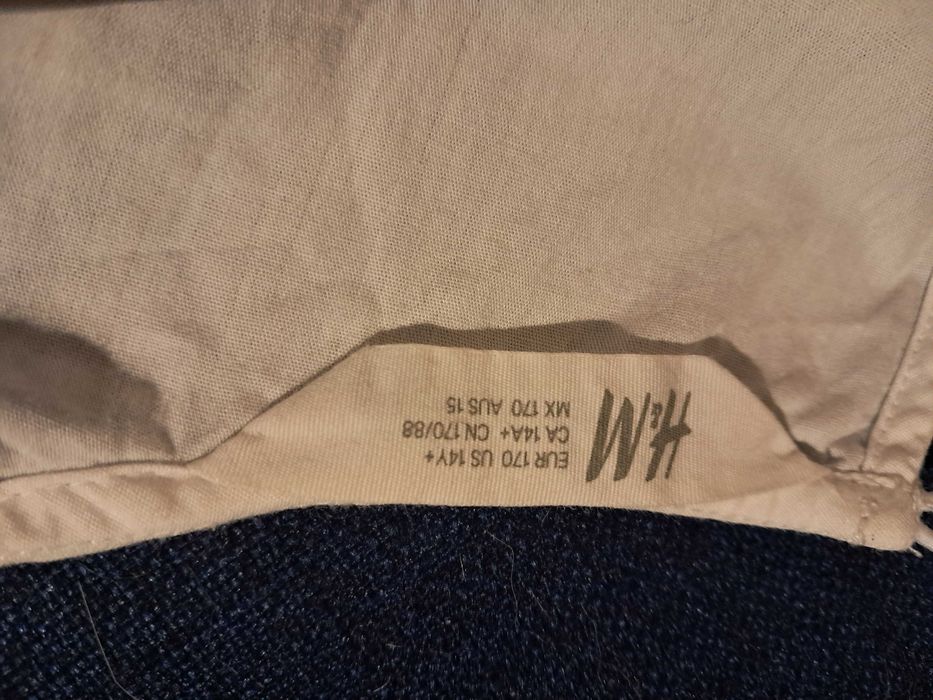Elegancka biała bluzka z baskinką i bufkami h&m