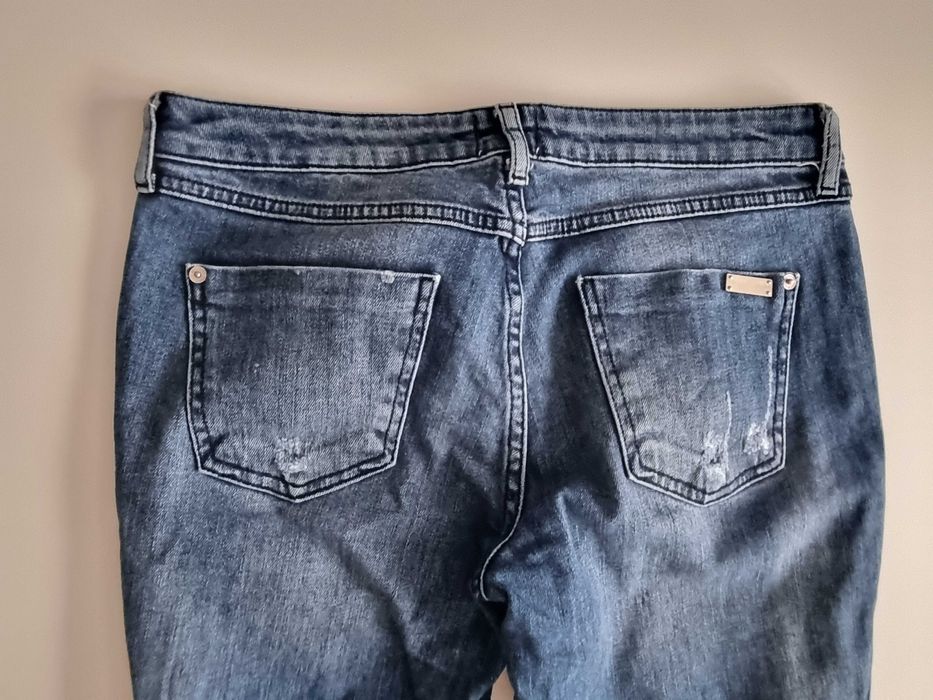 Spodnie z dziurami River Island 38(M)