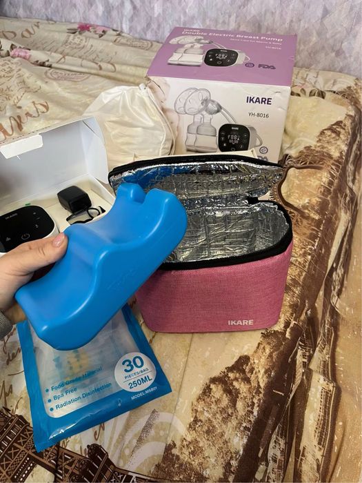 Новий подвійний молоковідсмоктувач