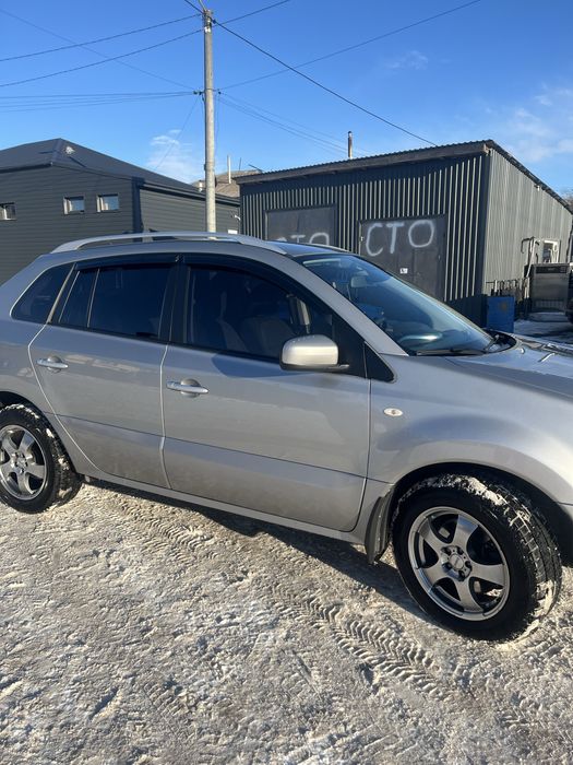 Машина Рено колеус