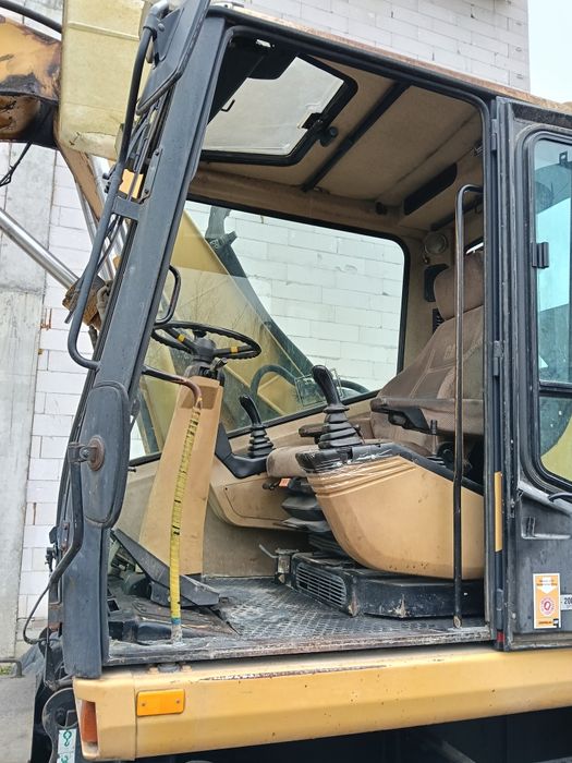 Екскаватор Caterpillar M312