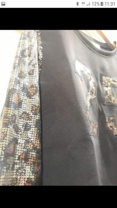 Sweat preta de lantejoulas M