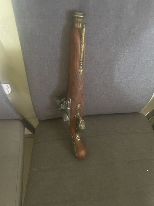 Arma antiga em bom estado