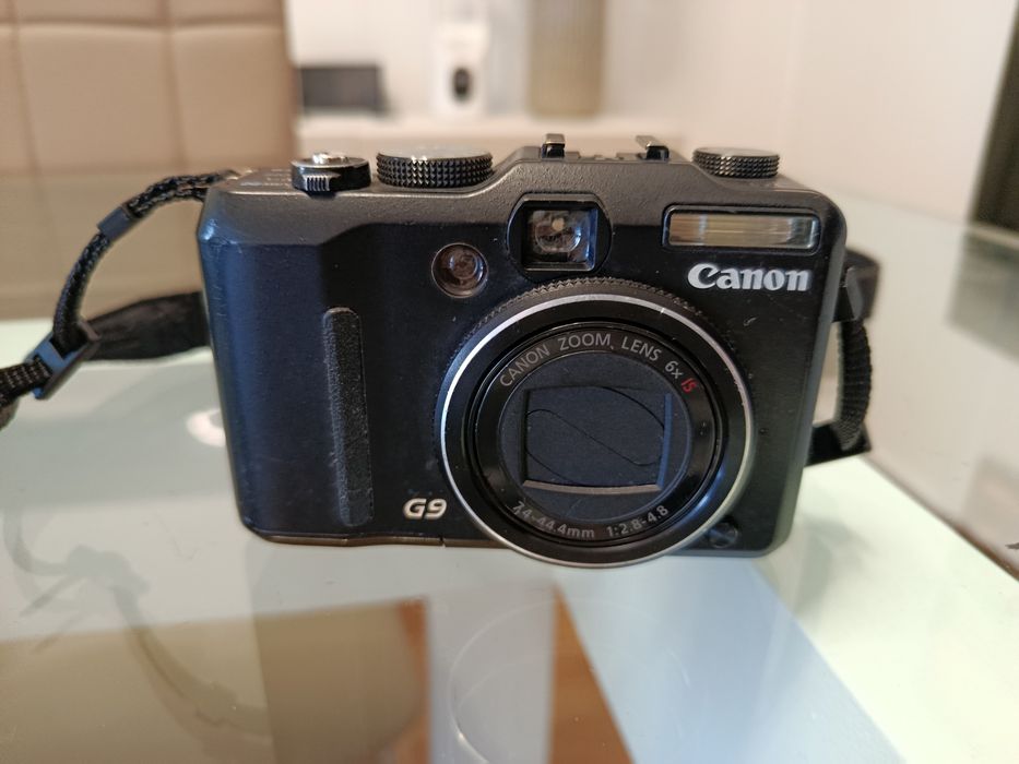 Canon G9 completa, carregador e 2 baterias, precisa limpar obturador ou para peças.