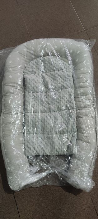 Ninho e almofada de amamentação