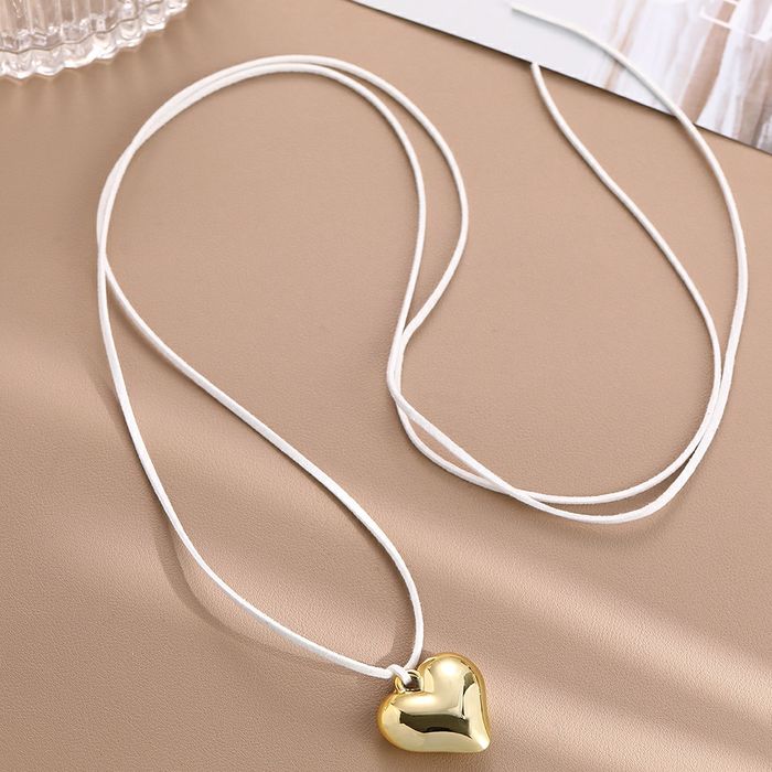 Прикраса Кулон підвіска сердце в золотому та срібному кольорі