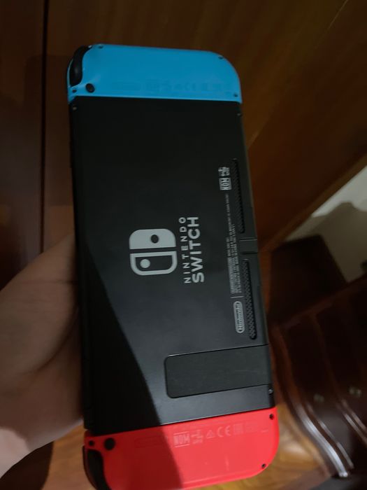 Nintendo switch com suporte para ligação a monitor/tv e capa