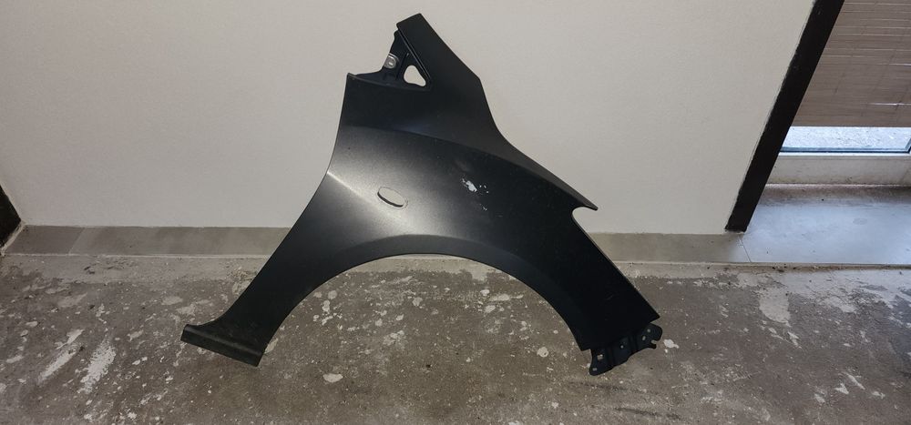 Guarda lamas mazda 2 2008