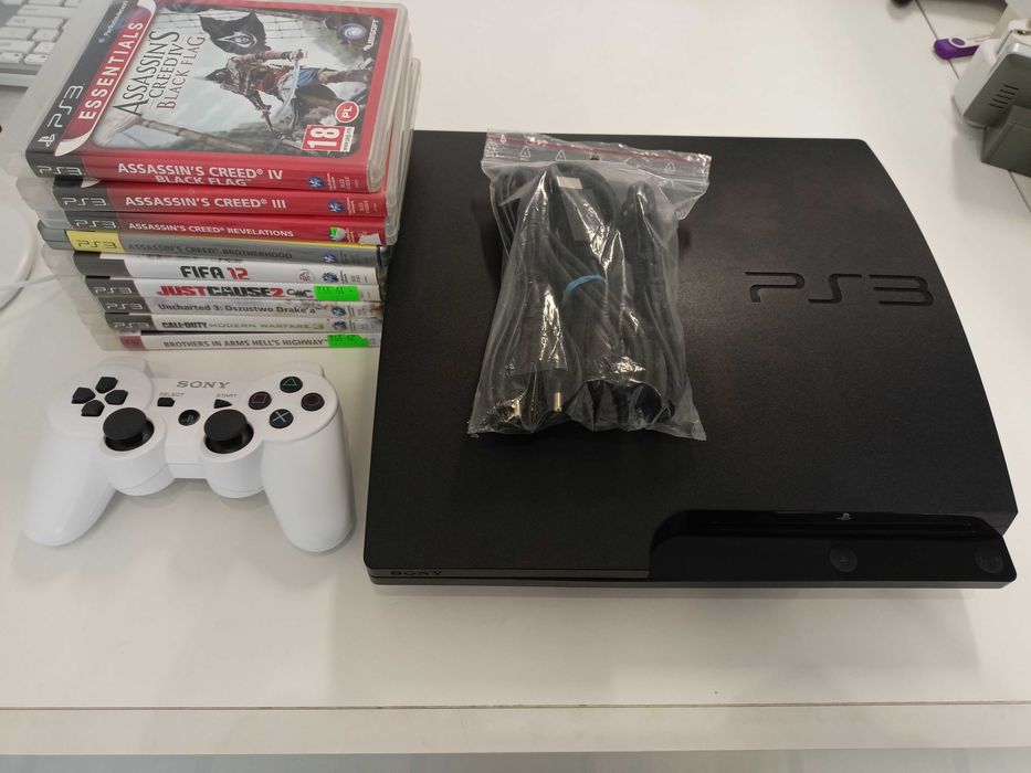Konsola PlayStation3 PS 3 Slim 320GB / 9 gier / pad / kable / Assassin's Creed / FIFA / JustCause 2 / MW3
