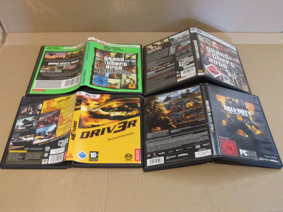 Lote 4 caixas de jogos de PC GTA Call of Duty Driver