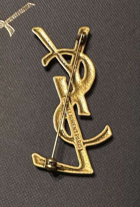 Broszka YSL stare złoto