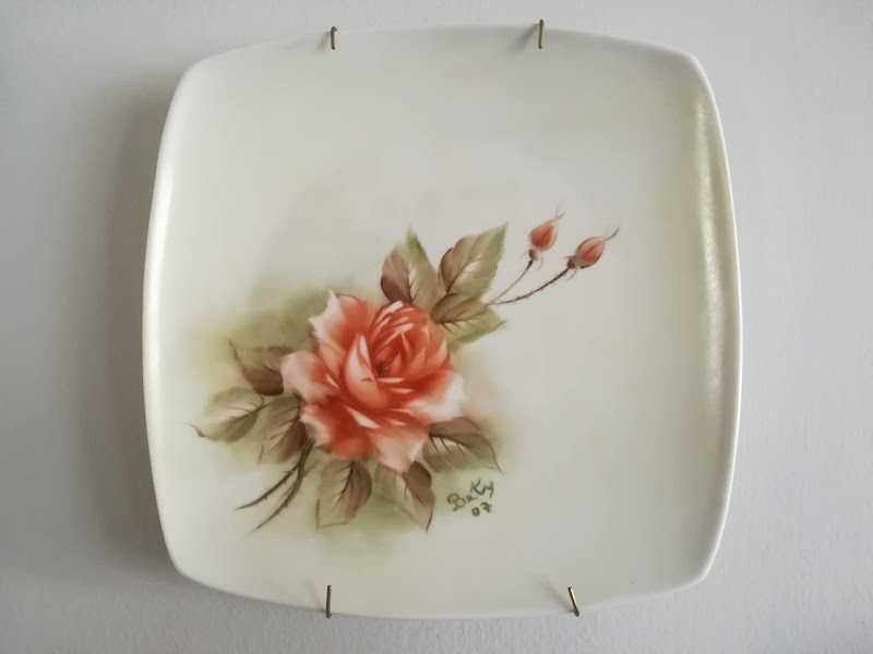 Hand-painted porcelain plates.428625429592156165