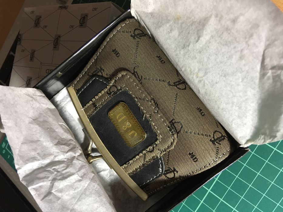 Porta moedas de mola