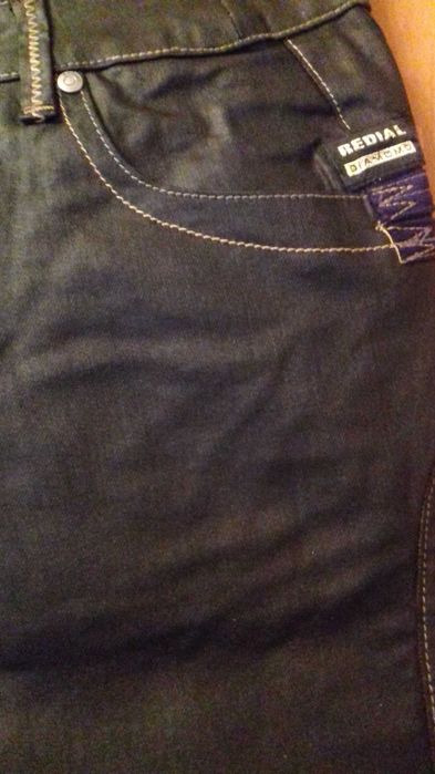 Spodnie z rozszerzaną nogawką dzwony a'la skóra woskowane Redial