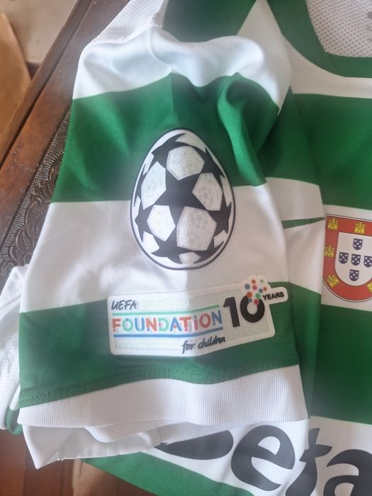 Camisola Sporting CP 25/26 bacdge e champions