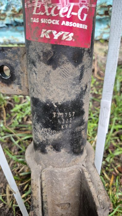 Peugeot амортизатор лівий передній Б/У (стойки підвіски)