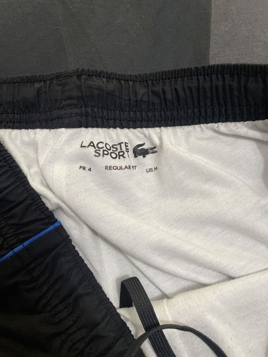 calças lacoste sport pretas e azuis