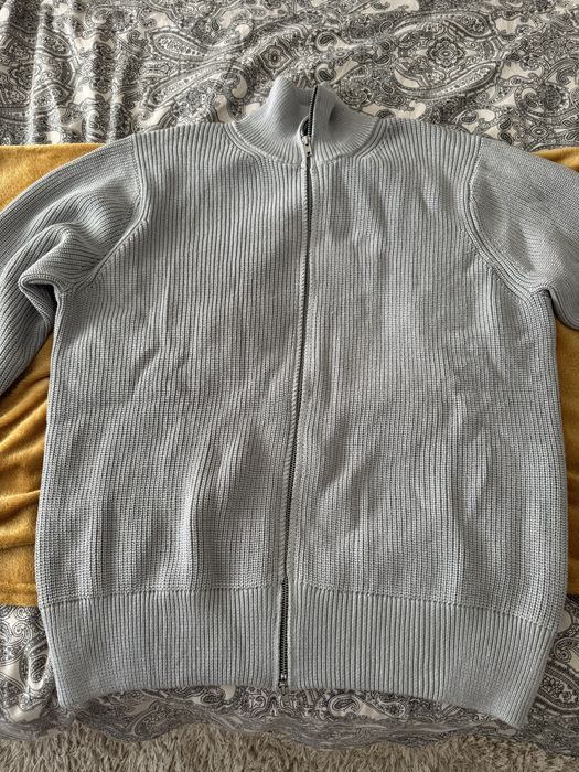 Cardigan de malha com fecho da Maison Margiela.