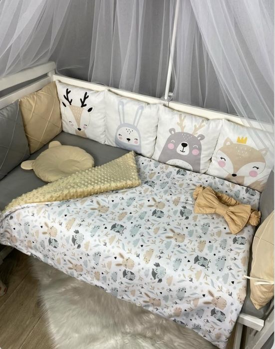 Бортики в дитяче ліжечко з постільною билизною