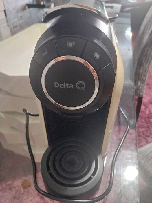 Maquina de café Delta Q com necessidade de arranjo