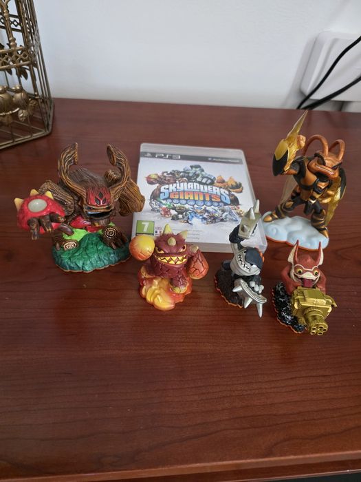 PS3 com jogos e portais e um comando