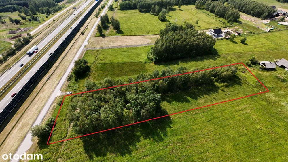 Działka inwestycyjna 7100 m² z mediami autostrada A4