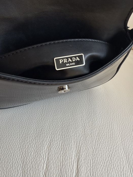 Prada.         burberry