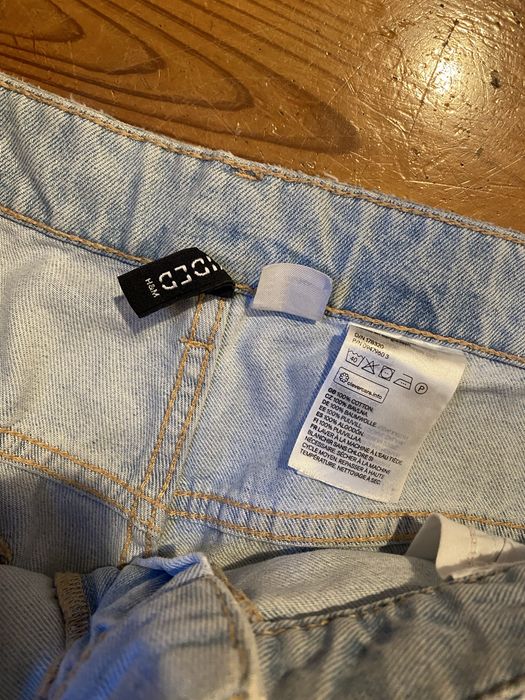 Jasnoniebieskie dżinsy z dziurami baggy spodnie denim quiet luxury paryski styl HM Studio
