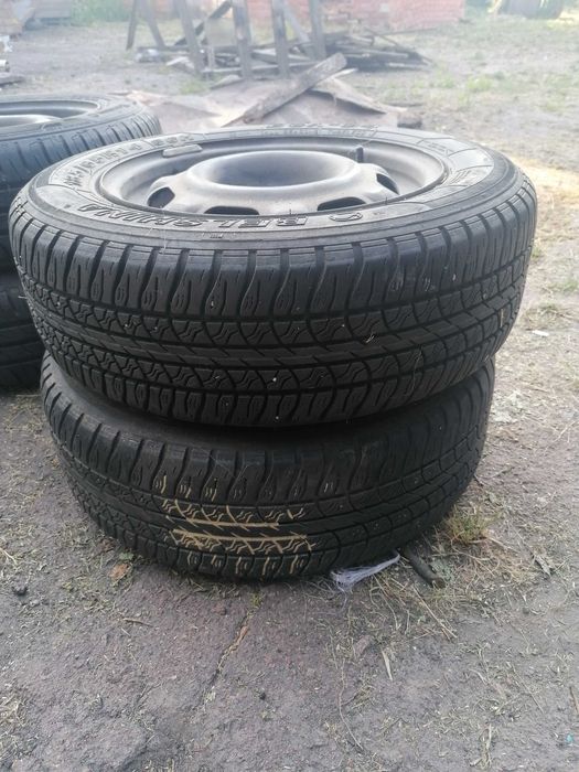 Продам колеса на 4 болта R 14 з резиною в комплекті розмір 185/65 R14