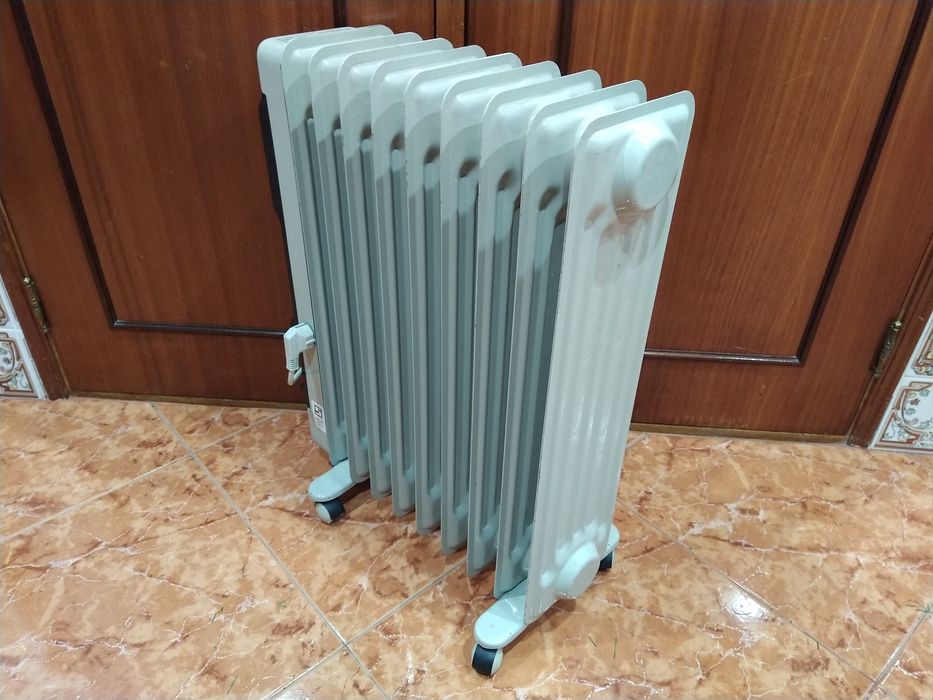 Aquecedor radiador a óleo  casa quarto apartamento vivenda escritório gabinete cozinha.