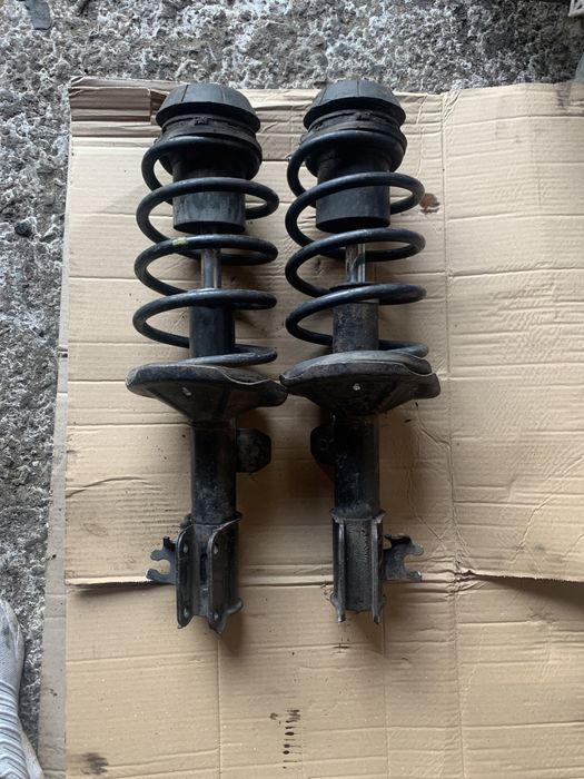 Передние стойки амортизаторы Шевроле Авео заз вида опоры пружины СТО