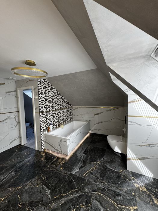 Łazienki, układanie płytek, kamienia, parapety, kominki.