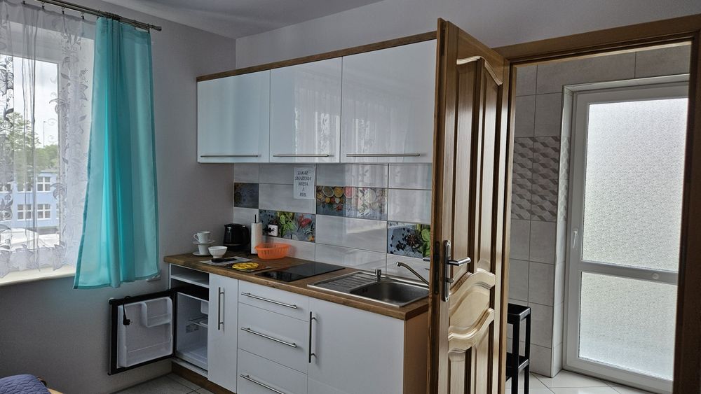 Pokoje i apartamenty z balkonami