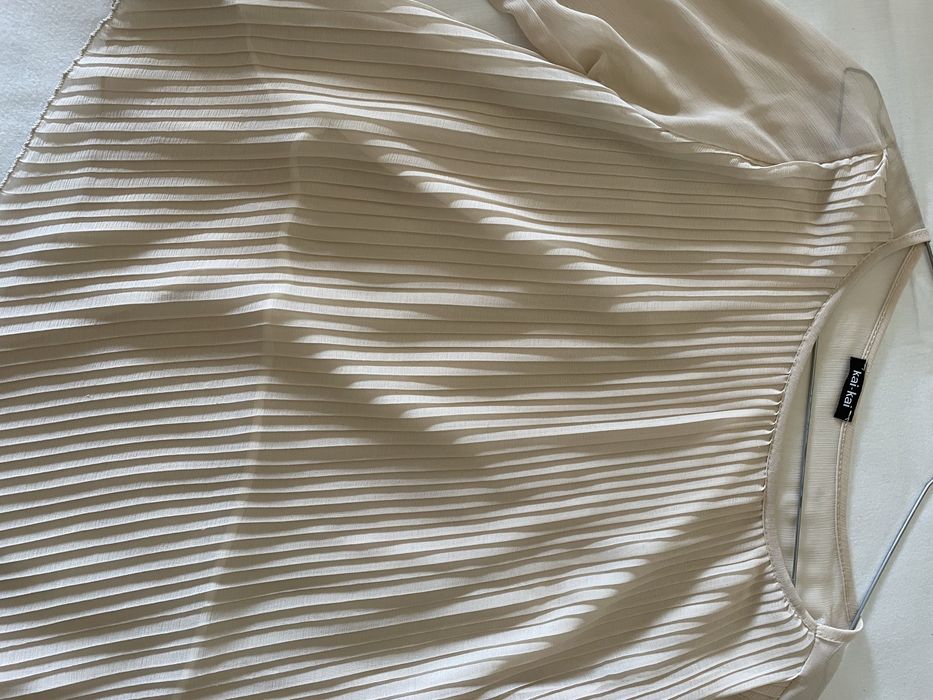 Blusa assimetrica plissada