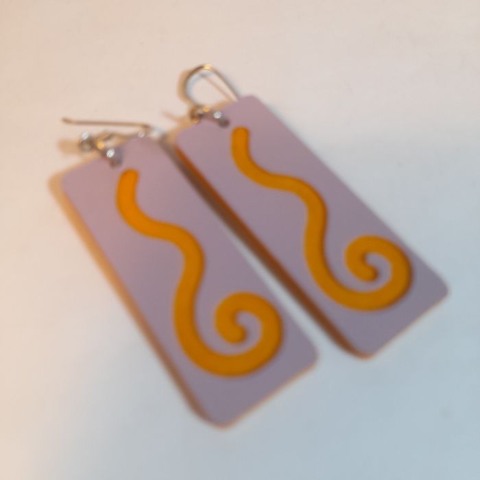 Wooden earrings with spiral design.