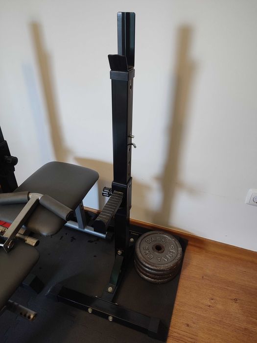 Suportes para barra e pesos de musculação