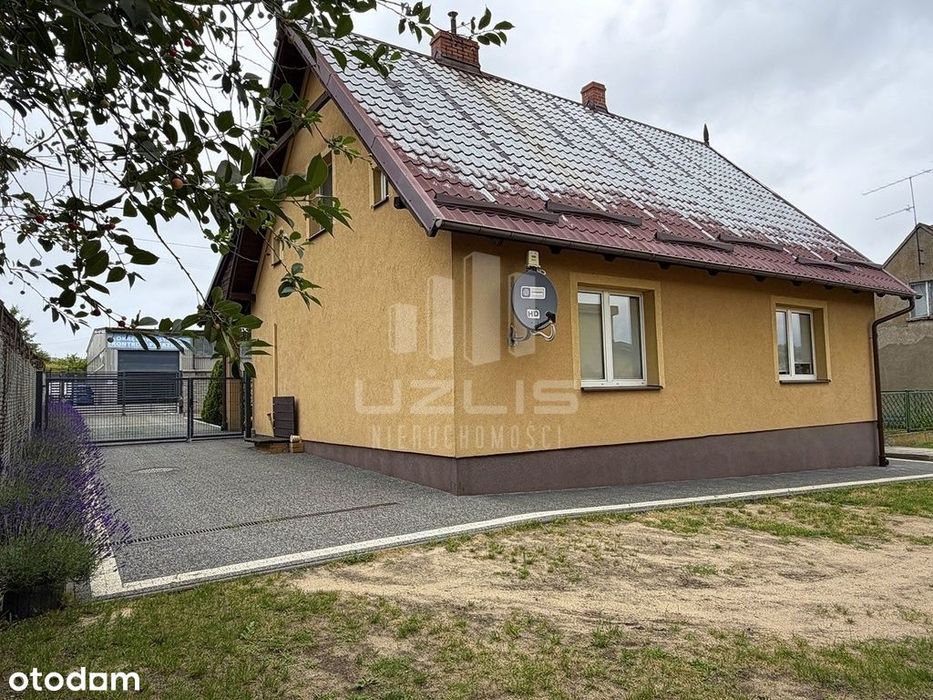 Dom z garażem i budynkiem gospodarczym