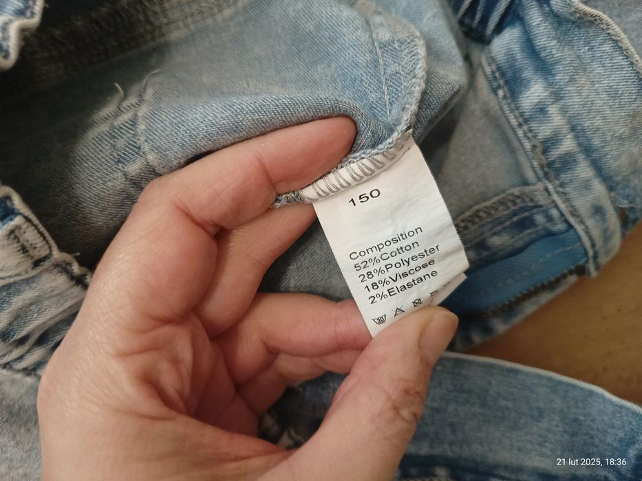 Spodnie dzwony z dziurami rozciągliwe dla dziewczynki rozm. 150