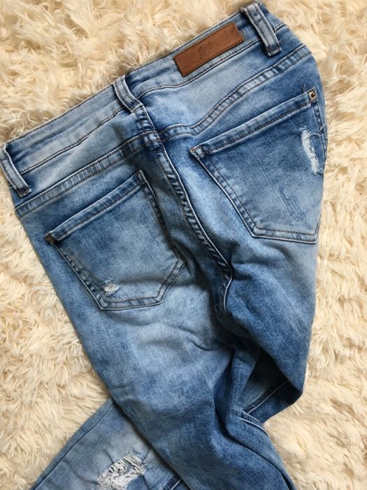 Jeansy z przetarciami xs s