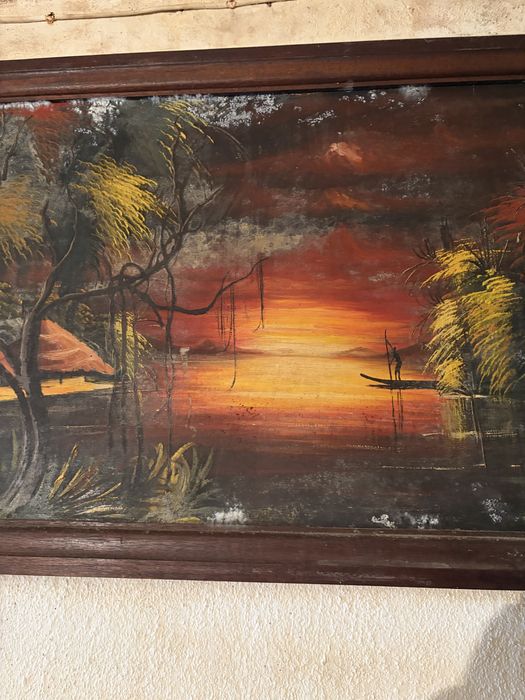 Quadro decorativo com uma pintura de uma paisagem tropical ao pôr do sol, semelhante a obras de arte de ilhas tropicais com palmeiras e barcos