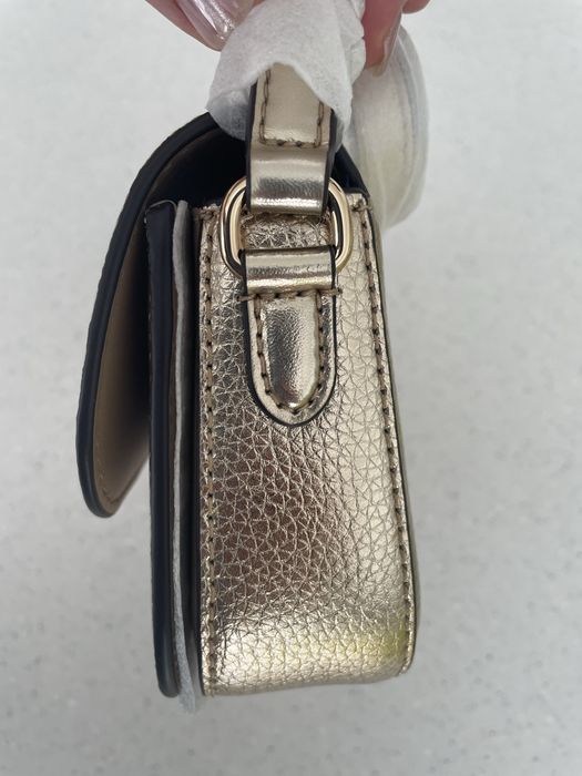 Нова сумка Michael Michael Kors Jet Set Travel, натуральна шкіра, колір pale gold, оригінал, є невеликий дефект.