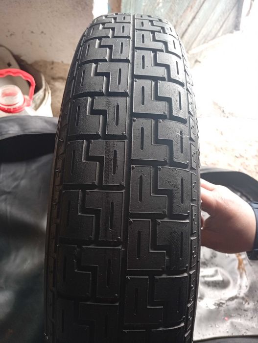 Докатка запаска на легковий автомобіль